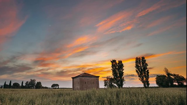 Catalonia, Spain. Spring Sunset Sky Above Spanish Countryside Rural Wheat Field Landscape. Lonely Barn Farm Building Farmhouse Under Scenic Dramatic Sky With Evening Clouds