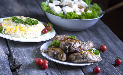 Grilled steaks and vegetable salad