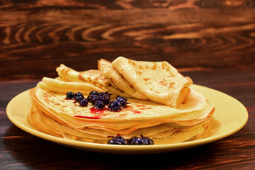 Pancakes with jam and berries. Delicious food.