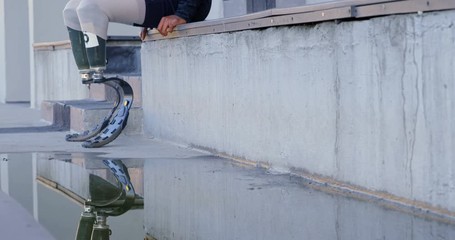 Disabled athletic sanding at sports venue 4k - Powered by Adobe