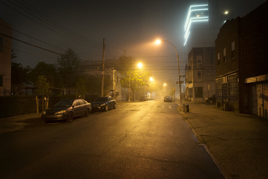 Empty road in city at night