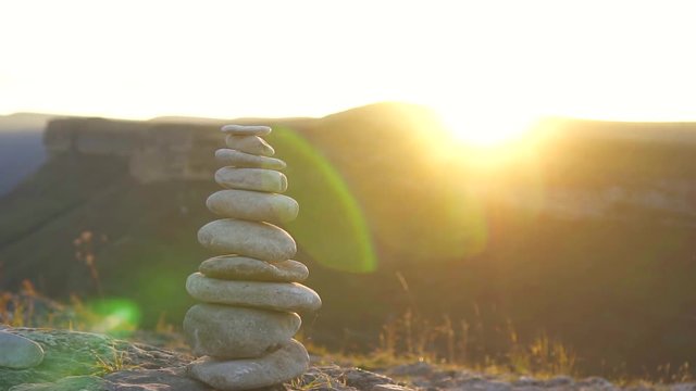 Stone pyramid at sunset.The concept of balance