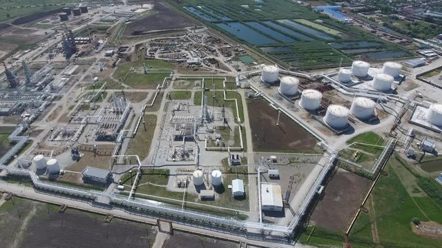 Oil refinery plant for primary and deep oil refining. Equipment and tanks in the oil refinery. Rectification and vacuum equipment