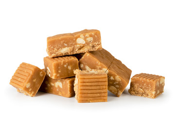 Heap of candy, toffee with peanuts on a white, isolated.