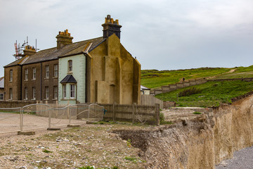Fototapeta premium Cottages in danger at Beachy Head,