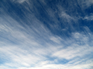 Fototapeta premium Blue sky with white cirrus clouds. Beautiful weather background