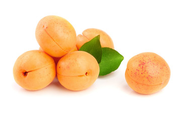 Apricot fruits with leaves isolated on white background macro