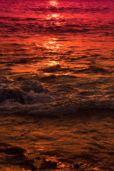 Abstract gradient texture of sunset reflection in the sea water