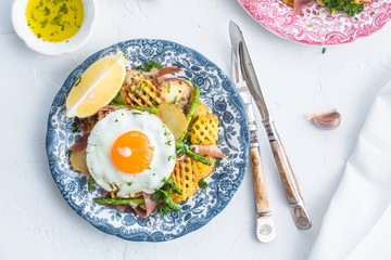 Huevos rotos, eggs, potatoes and serrano ham.
