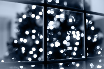 Blurred Christmas Tree Lights Seen Through Window, Abstract Background