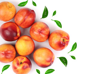 ripe nectarine with leaves isolated on white background with copy space for your text. Top view. Flat lay pattern