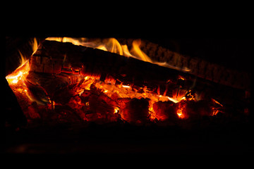 camp fire ember flames close up
