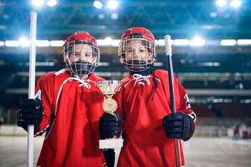 Fototapeta premium boys players ice hockey winner trophy.