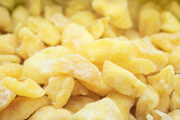 Background dried pineapples closeup