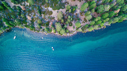 Drone view of the shore with boats at Lake Tahoe California