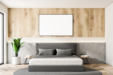 Wooden and white master bedroom with poster