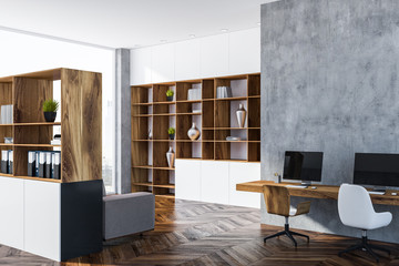 Gray home office corner, wooden bookcase
