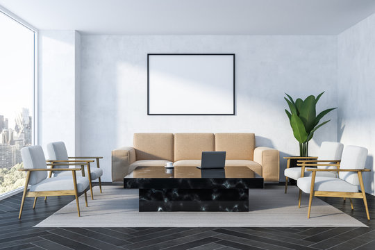 White living room, beige sofa and poster