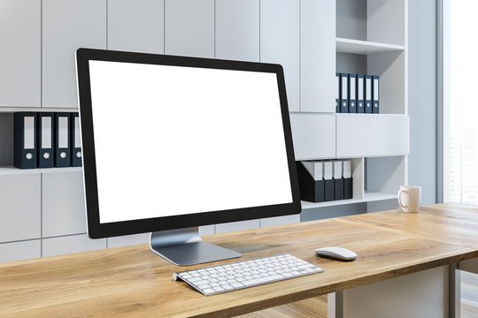 Mock up computer screen in white office interior
