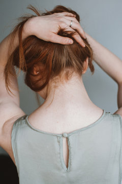 Woman holding her hair