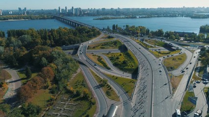 Aerial drone footage. Marathon running on the road junction, wide shot