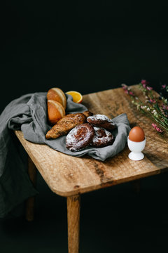 french healthy breakfast with fruit, croissansts and orane juice on the table