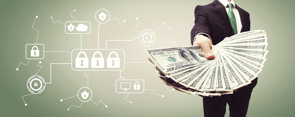 Cyber Security with business man displaying a spread of cash