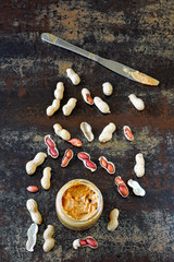 Peanut paste and peanuts. Vegan snack. Keto snack. Vegetable protein concept.