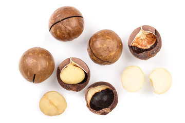 Shelled and unshelled macadamia nuts isolated on white background. Top view. Flat lay pattern
