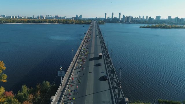 Aerial Drone Fooage. Marathon Running On The Bridge.