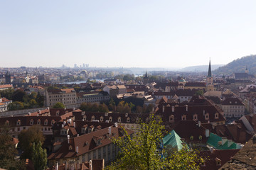 Fototapeta premium Autumn Prague City with with its Buildings, Towers, Cathedrals and Bridges in the sunny Day, Czech Republic