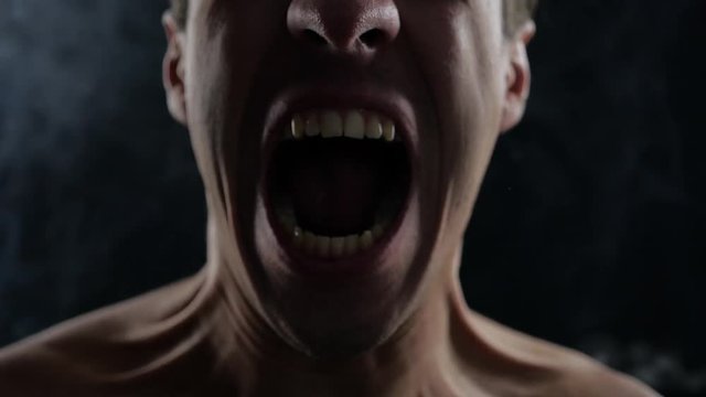 close up man horror scream on misty foggy background