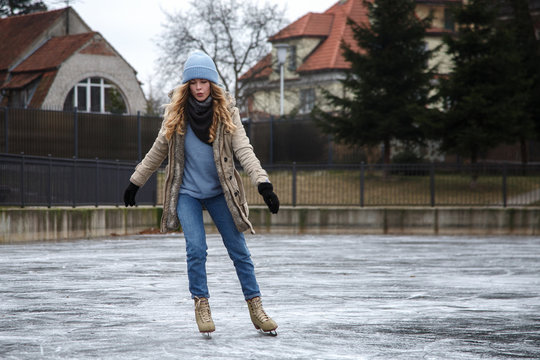Young woman riding skates