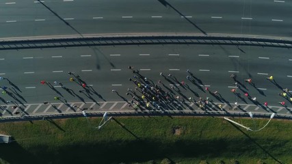 Aerial Drone Fooage. Following Marathon Running On road bridge. Top View