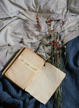 above view of a book on bed with the quote 'relax,  refresh, recconect' writed in it
