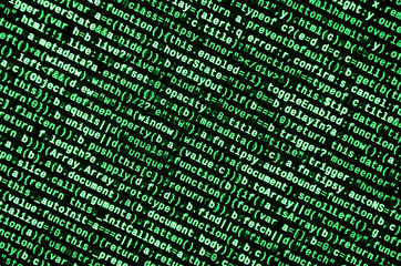 Writing programming code on laptop. Digital binary data on computer screen