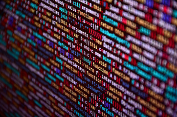Software developer programming code on computer. Abstract computer script source code