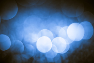 abstract Christmas background with holiday lights and copy space - magic bokeh glitter with blinking stars and falling snowflakes