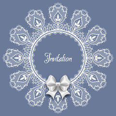 Wedding card or invitation template with a filigree lace round frame and white satin bow