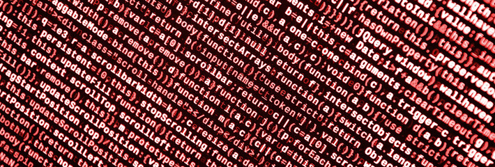 Writing programming code on laptop. Digital binary data on computer screen