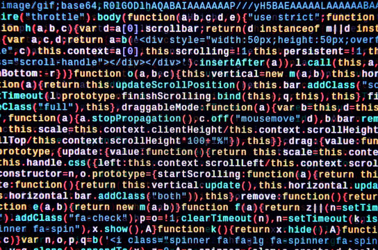 Writing programming code on laptop. Digital binary data on computer screen