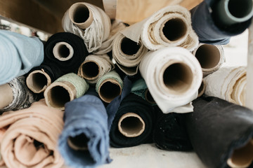 rolls of fabric stacked together