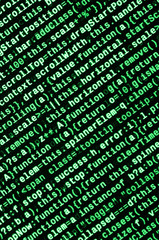 Writing programming code on laptop. Digital binary data on computer screen