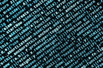 Writing programming code on laptop. Digital binary data on computer screen
