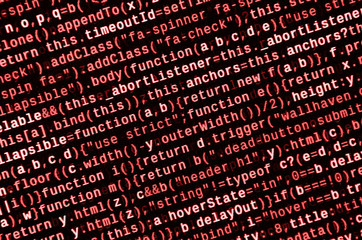 Writing programming code on laptop. Digital binary data on computer screen