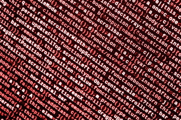 Writing programming code on laptop. Digital binary data on computer screen