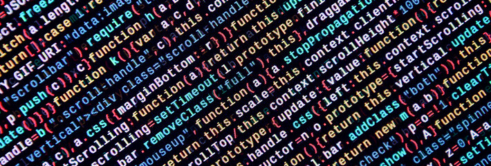 Writing programming code on laptop. Digital binary data on computer screen