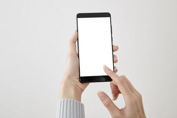 Woman hand holding mobile phone