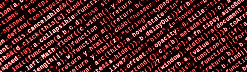Writing programming code on laptop. Digital binary data on computer screen