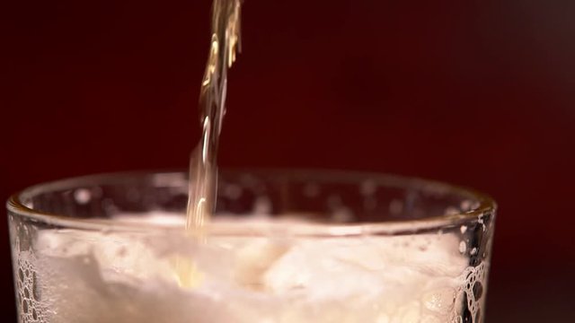 Pouring a glass of frothy beer